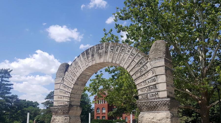 Old Main in the background of Nebraska Wesleyan's historic arch.